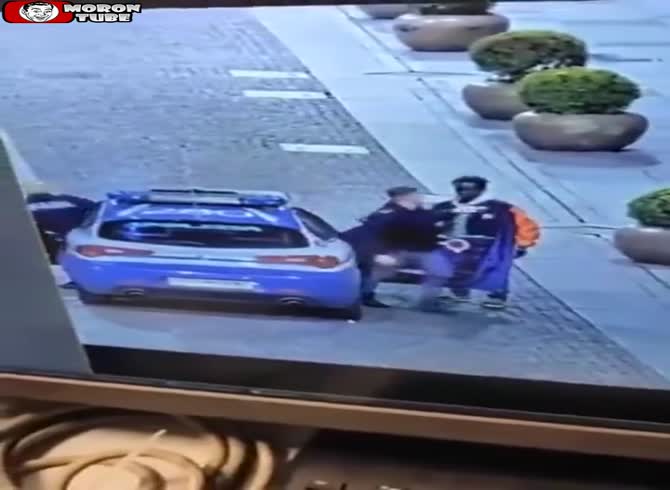 Video :When a guy stops a police car from approaching and attacks the policemen, he immediately feels bad about it